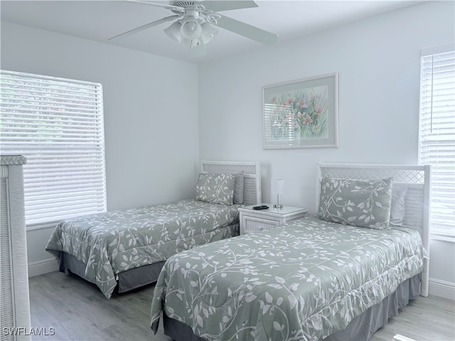 bedroom featuring light hardwood / wood-style floors and ceiling fan