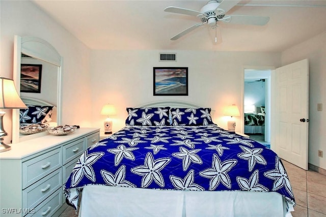 bedroom featuring ceiling fan and light tile patterned flooring