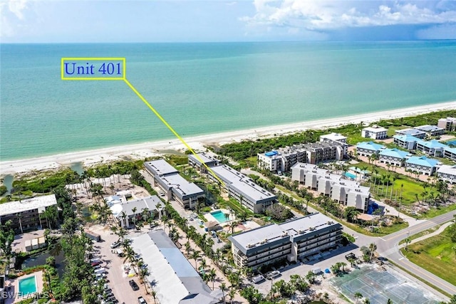 aerial view with a view of the beach and a water view