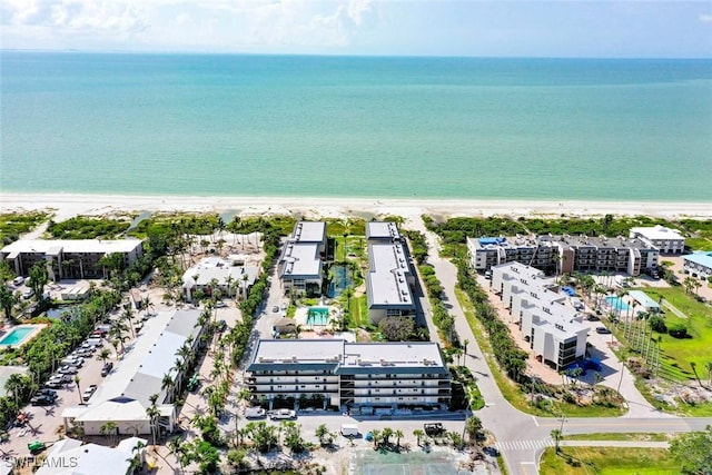 bird's eye view featuring a beach view and a water view