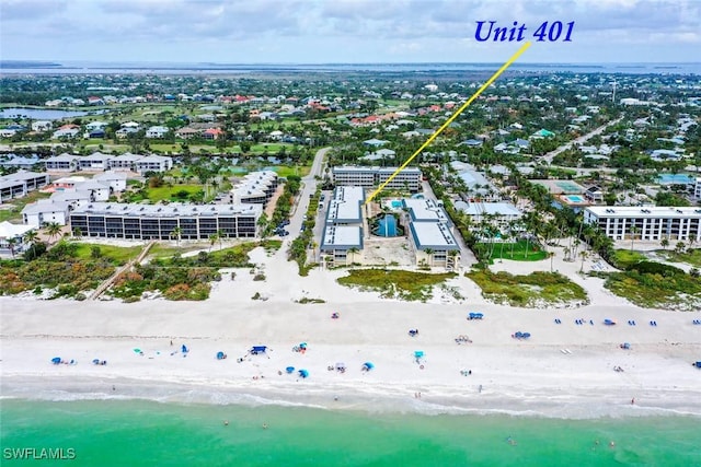 aerial view featuring a view of the beach and a water view