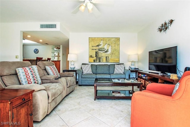 tiled living room featuring ceiling fan