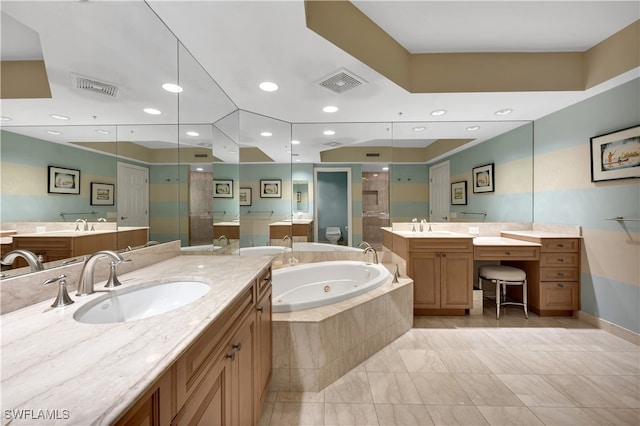 full bathroom featuring shower with separate bathtub, vanity, and toilet