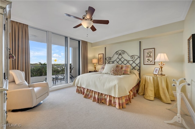 carpeted bedroom featuring expansive windows, access to outside, ceiling fan, and crown molding