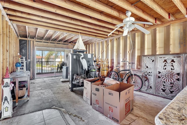 interior space with ceiling fan