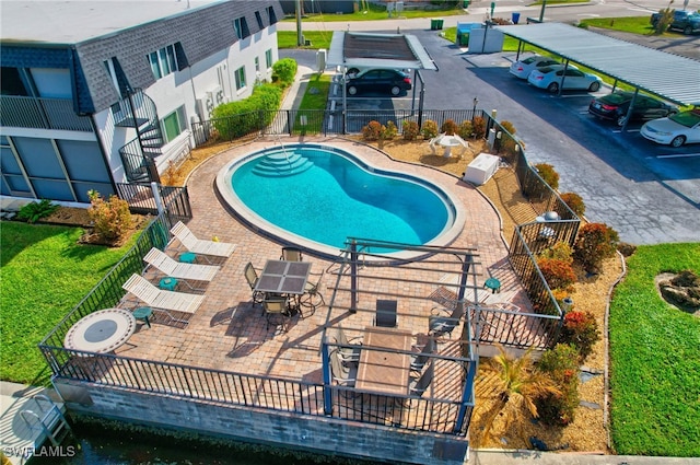 view of pool with a yard and a patio area