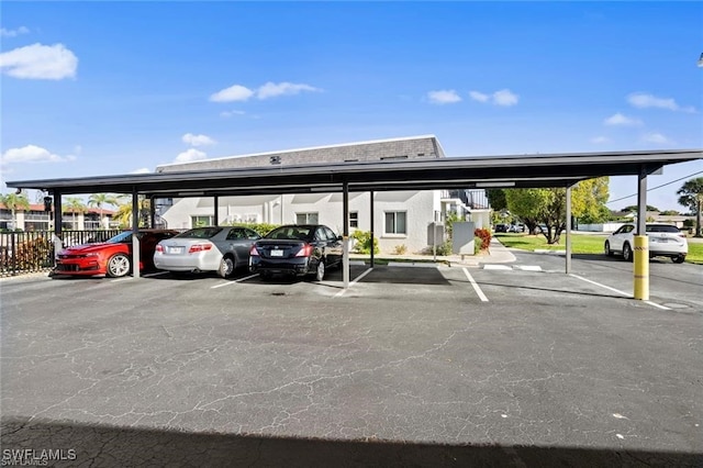 view of parking / parking lot featuring a carport