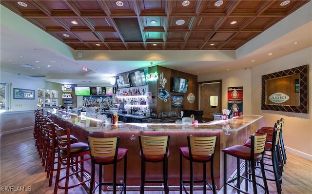 bar featuring hardwood / wood-style floors