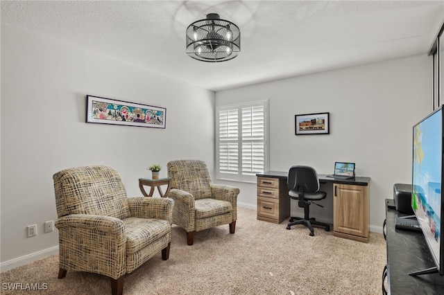 office with a textured ceiling, light carpet, and a chandelier