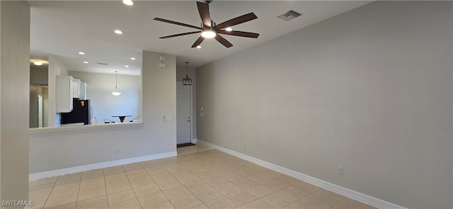 spare room with ceiling fan