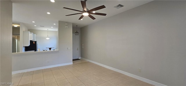 unfurnished room featuring light tile patterned floors and ceiling fan