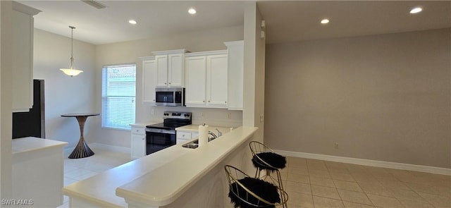 kitchen featuring sink, stainless steel appliances, white cabinets, and light tile patterned flooring