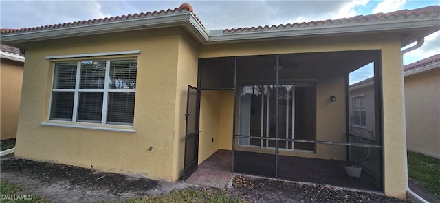 exterior space featuring a sunroom