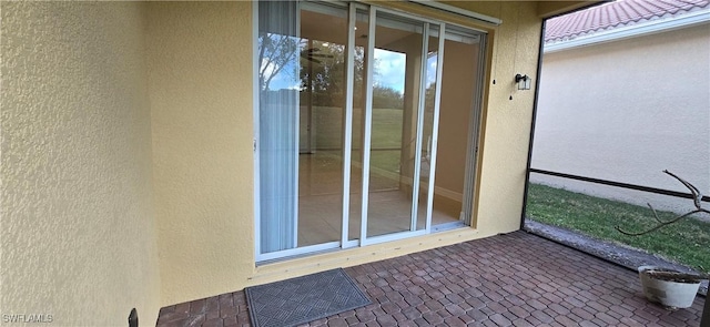 entrance to property with a patio area