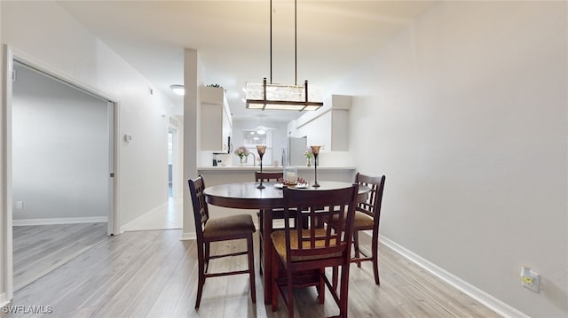 dining room with light wood-type flooring