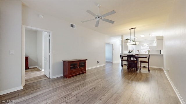 dining space featuring light hardwood / wood-style flooring and ceiling fan