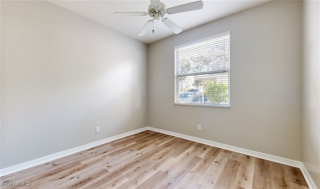 empty room with light hardwood / wood-style flooring and ceiling fan