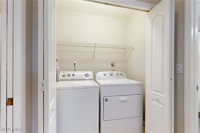 washroom featuring separate washer and dryer