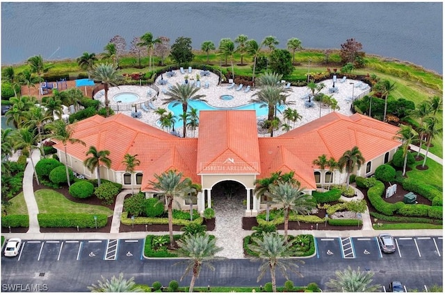 birds eye view of property featuring a water view