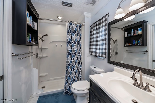 bathroom featuring toilet, a textured ceiling, vanity, crown molding, and walk in shower