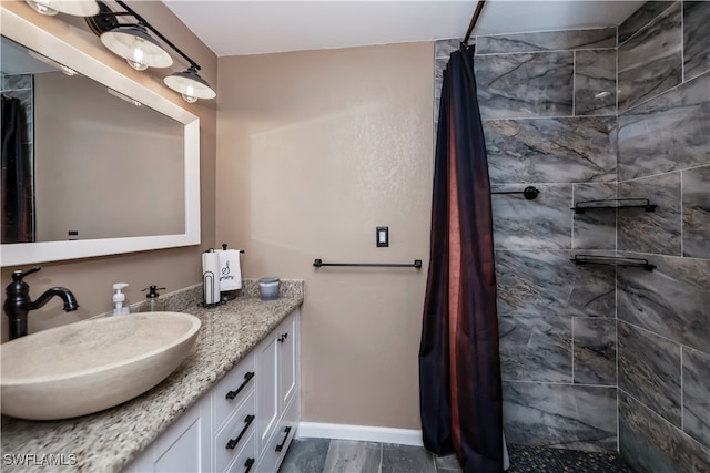 bathroom with hardwood / wood-style floors, vanity, and a shower with curtain