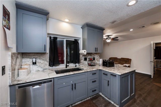 kitchen featuring dark hardwood / wood-style flooring, sink, decorative backsplash, stainless steel dishwasher, and ceiling fan