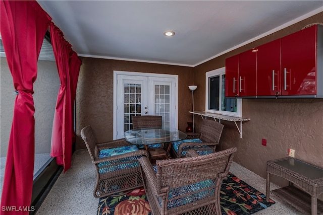 dining room with french doors and crown molding