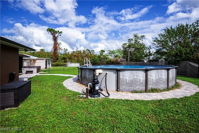 exterior space featuring a swimming pool with hot tub