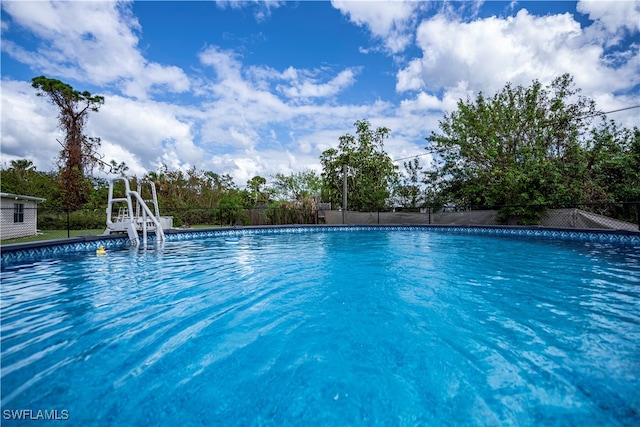 view of pool with a water slide