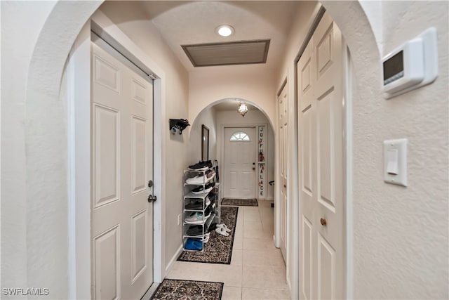 entryway featuring light tile patterned floors