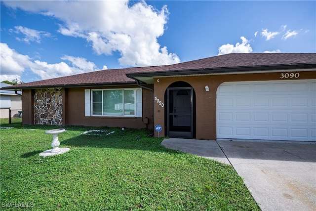 single story home with a garage and a front yard