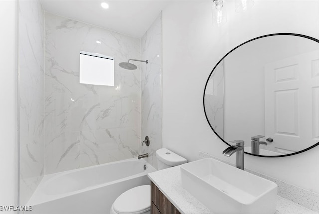 full bathroom featuring vanity, toilet, and tiled shower / bath