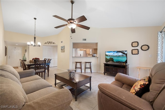 living room featuring high vaulted ceiling, light tile patterned flooring, and ceiling fan with notable chandelier