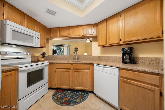 kitchen with white appliances, sink, light tile patterned floors, and ceiling fan