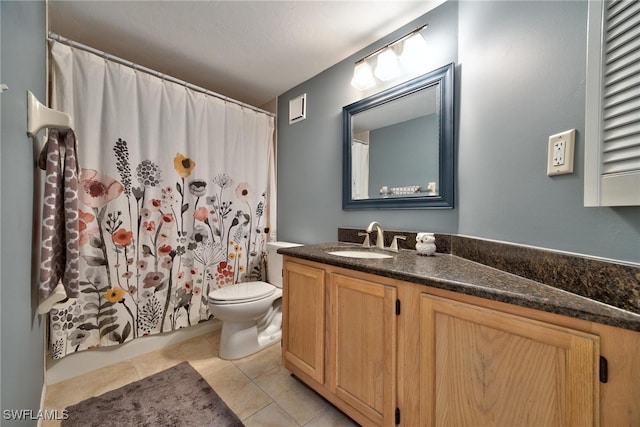 bathroom with toilet, a shower with curtain, vanity, and tile patterned flooring