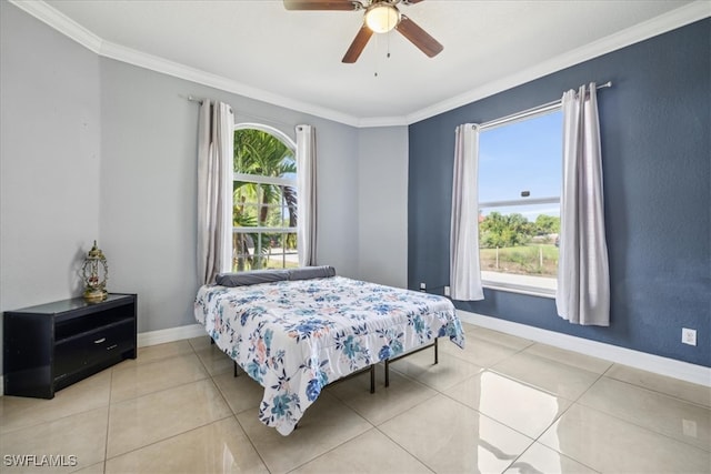 bedroom featuring ceiling fan, light tile patterned floors, and ornamental molding