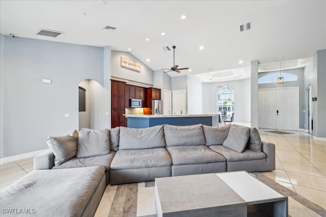 living room featuring high vaulted ceiling, light tile patterned floors, and ceiling fan