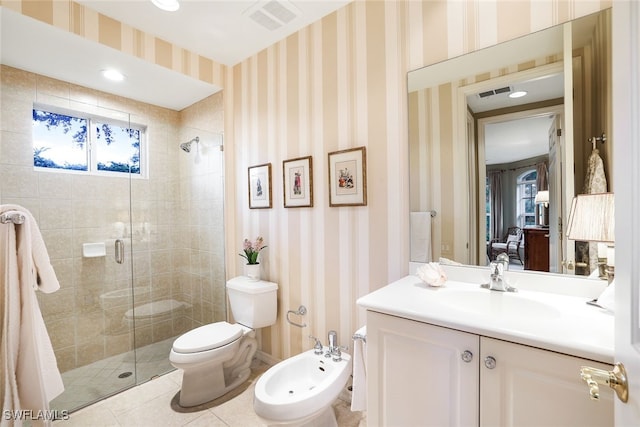 bathroom featuring a bidet, toilet, a shower with door, tile patterned flooring, and vanity