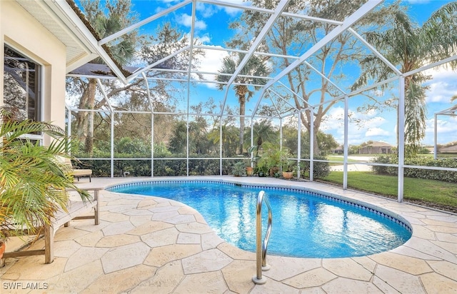 view of swimming pool featuring glass enclosure and a patio