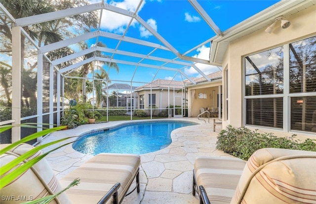 view of pool featuring a patio area and a lanai