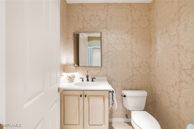 bathroom featuring toilet and vanity