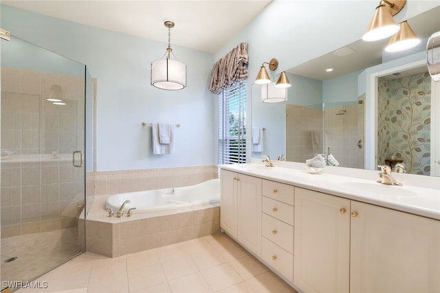 bathroom featuring independent shower and bath, vanity, and tile patterned floors