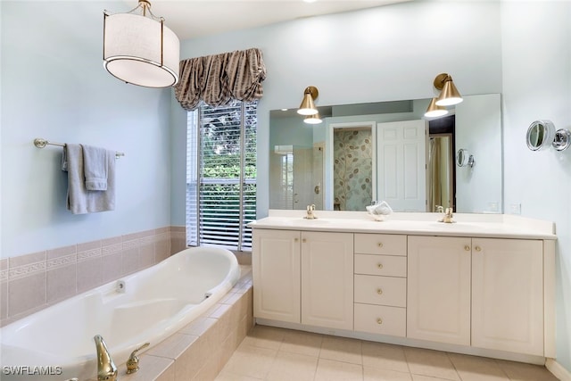 bathroom with vanity, tile patterned flooring, and separate shower and tub