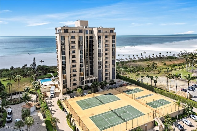 birds eye view of property featuring a water view and a view of the beach