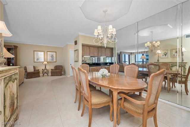 dining area with a textured ceiling, light tile patterned floors, and a notable chandelier