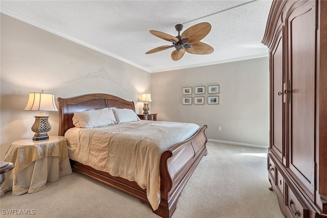 carpeted bedroom with a textured ceiling, ceiling fan, and crown molding