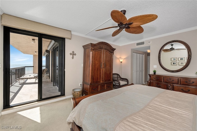 carpeted bedroom with ceiling fan, ornamental molding, a textured ceiling, and access to outside