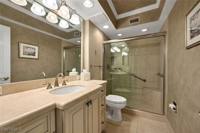 bathroom with tile patterned floors, a shower with door, crown molding, vanity, and toilet