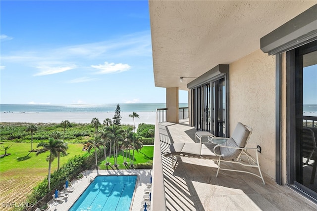 balcony featuring a water view