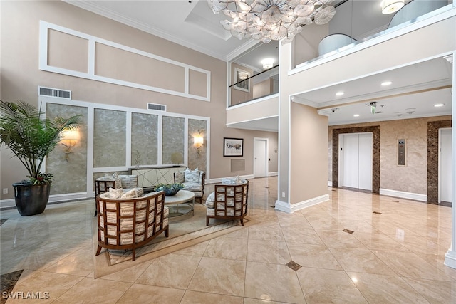 interior space featuring a high ceiling, elevator, a chandelier, and ornamental molding